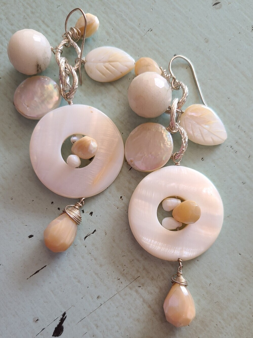 Pearlescent Cream Shell Drop Earrings with Leaf Accents